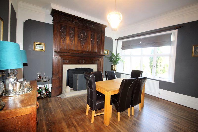 The central feature of this delightful room is the superb and ornate carved wood period fireplace.