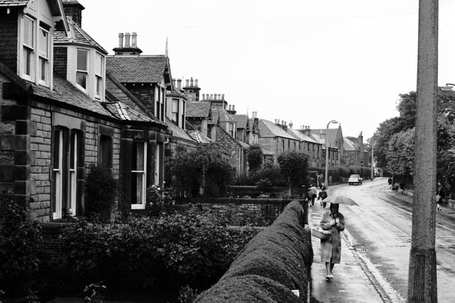 View of Kirkgate, Liberton, in 1965, showing  front gardens with neatly trimmed hedges.
