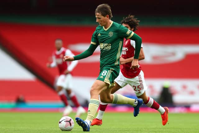Sheffield United's Norwegian midfielder Sander Berge runs with the ball during the English Premier League football match between Arsenal and Sheffield United at the Emirates Stadium in London on October 4, 2020. (Photo by Clive Rose / POOL / AFP)