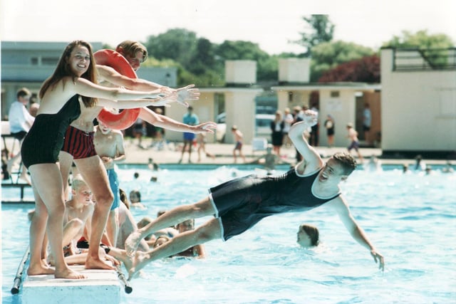 Sorry! A swimmer is pushed into the water in July 1995, as the lido celebrated its 60th anniversary.