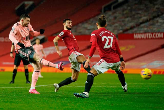 Sheffield United striker Oliver Burke scores his side's winner in the 2-1 victory over Manchester United at Old Trafford last night. (Photo by TIM KEETON/POOL/AFP via Getty Images)