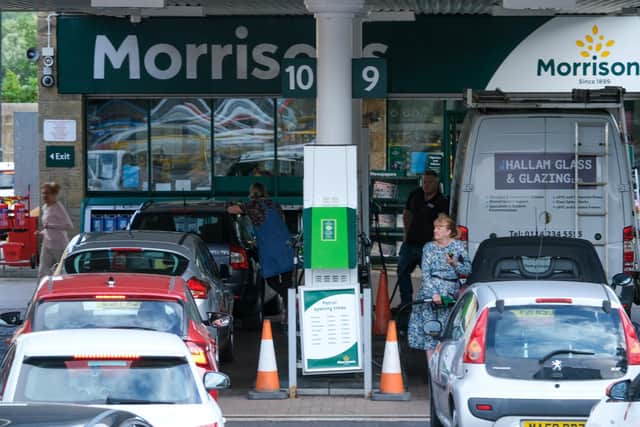 Motorists queue to fill their cars with fuel at Morrisons store in Hillsborough Sheffield as a number of stations were forced to close due to a shortage of tanker drivers in the UK
Picture Dean Atkins