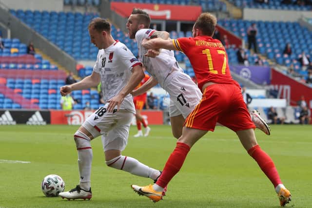 Wales' defender Rhys Norrington-Davies (R) challenges Albania's defender Albi Doka (C) and Albania's defender Ardian Ismajli (L) during the international friendly football match between Wales and Albania at Cardiff City Stadium in Cardiff, South Wales, on June 5, 2021. (Photo by Geoff Caddick / AFP) (Photo by GEOFF CADDICK/AFP via Getty Images)