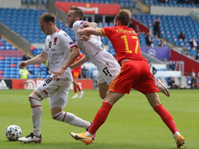 Wales' defender Rhys Norrington-Davies (R) challenges Albania's defender Albi Doka (C) and Albania's defender Ardian Ismajli (L) during the international friendly football match between Wales and Albania at Cardiff City Stadium in Cardiff, South Wales, on June 5, 2021. (Photo by Geoff Caddick / AFP) (Photo by GEOFF CADDICK/AFP via Getty Images)
