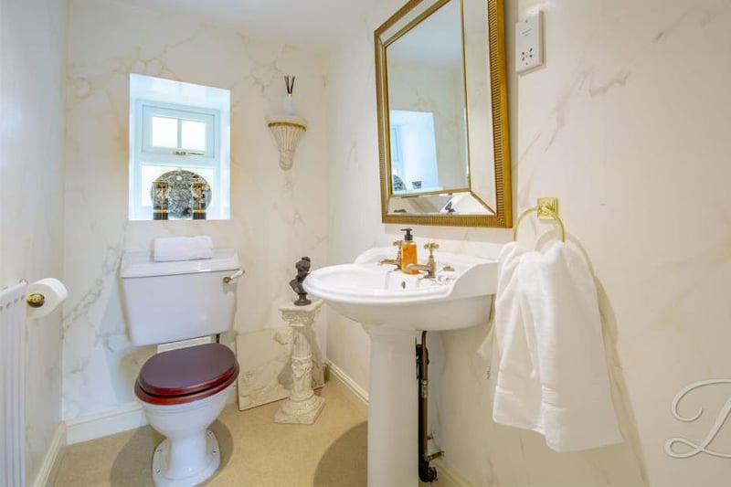 A downstairs toilet always comes in handy. It comes complete with a pedestal sink, low-flush WC, central-heating radiator and opaque window.