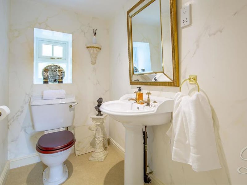 A downstairs toilet always comes in handy. It comes complete with a pedestal sink, low-flush WC, central-heating radiator and opaque window.