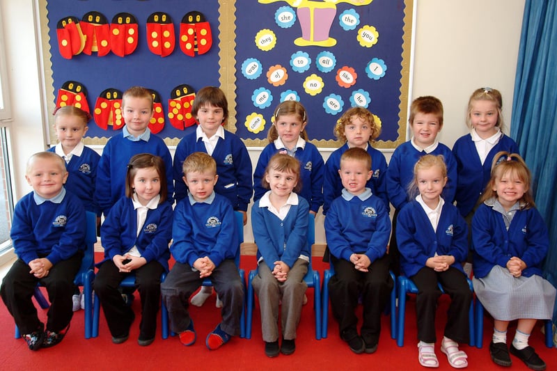 Children at Norbridge Primary School smile for the camera.