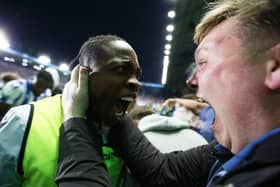 SHEFFIELD, ENGLAND - MAY 18: Dennis Adeniran of Sheffield Wednesday celebrates with a fan after the teams fourth goal during the Sky Bet League One Play-Off Semi-Final Second Leg match between Sheffield Wednesday and Peterborough United at Hillsborough on May 18, 2023 in Sheffield, England. (Photo by Matt McNulty/Getty Images)
