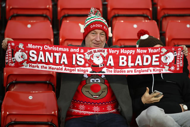 A United supporter gets into the Christmas spirit at the Boxing Day clash with Watford at Bramall Lane.