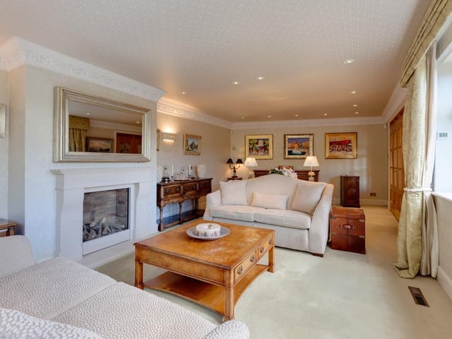 The cosy lounge is generous in size and features a log effect gas fire with a limestone mantel at its heart. The room also has front and side facing double glazed windows with electric curtain rails.