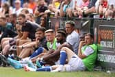 Emmanuel Dennis, Maduka Okoye and Dan Gosling of Watford look on from the subs bench during a pre-season friendly between Watford and Southampton: Richard Heathcote/Getty Images