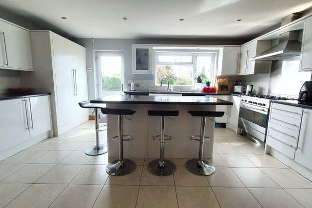 There’s also a large fully fitted kitchen with breakfast bar island