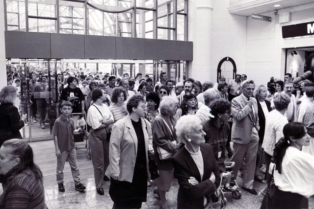 The opening day rush on September 4 1990. Shops still open include: HSBC, Charles Clinkard, The Music Box and Oliver's Font to Altar.