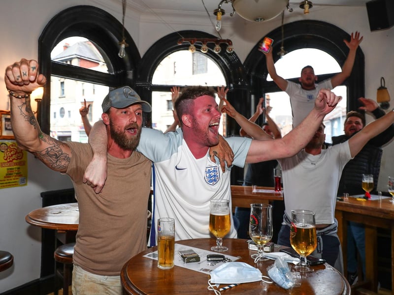 Fans pictured in The Kings pub celebrating on the final whistle. Picture: Stuart Martin (220421-7042)