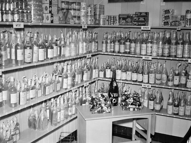 A Christmas display of bottle of port, sherry and jars of jam in an Edinburgh store in 1958.