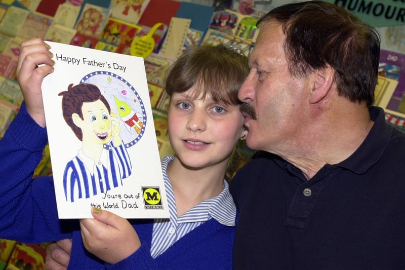 Sara Hopper, aged 10, shows off her winning father's day card design which was made up into a proper card by Morrison's. Giving his daughter a congratulatory kiss is dad Maurice Hopper. The presentation took place at Morrison's store, York Road, Doncaster in June 2008