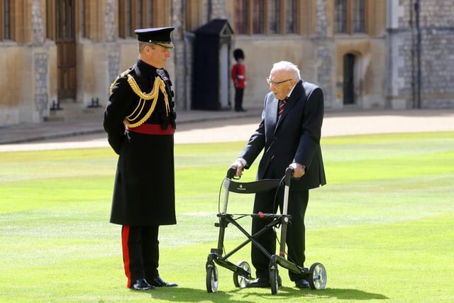 100-year-old WWII veteran Captain Tom Moore attends an investiture where he will be made a Knight Bachelor during at Windsor Castle in Windsor on July 17, 2020. (Photo by Chris Jackson / POOL / AFP)