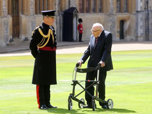100-year-old WWII veteran Captain Tom Moore attends an investiture where he will be made a Knight Bachelor during at Windsor Castle in Windsor on July 17, 2020. (Photo by Chris Jackson / POOL / AFP)