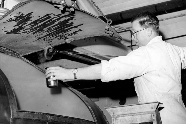 Checking the brew at the Exchange Brewery in July 1962