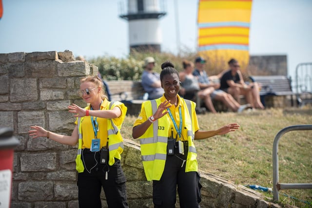 Security guards dancing to Great Scott 80s on the Seaside Stage. Picture: (250819-016)