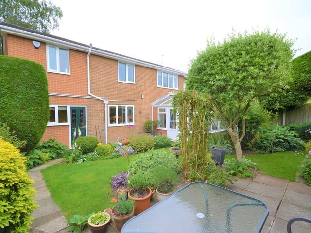 Rear Garden - Wrought iron gates to either side of the property give access to a fully enclosed and private rear garden, having mature trees, shrubs and flowers frame various patio seating areas and well kept lawn, there is access back into the breakfast room and conservatory.