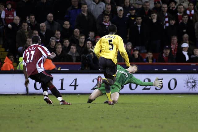 Sheffield United's Christian Nade scores the winner against Arsenal goalkeeper Jens Lehmann