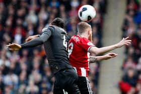 Virgil van Dijk of Liverpool and Oli McBurnie of Sheffield Utd - Simon Bellis/Sportimage