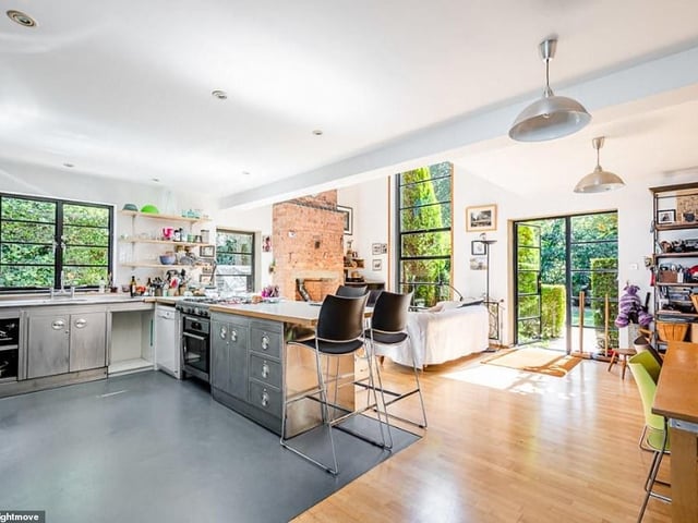 The 4,600 square foot property is currently divided into two homes, and also comes with a creative workshop perfect for home working.