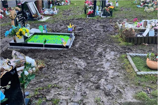 Slippery mud has made part of the cemetery dangerous.