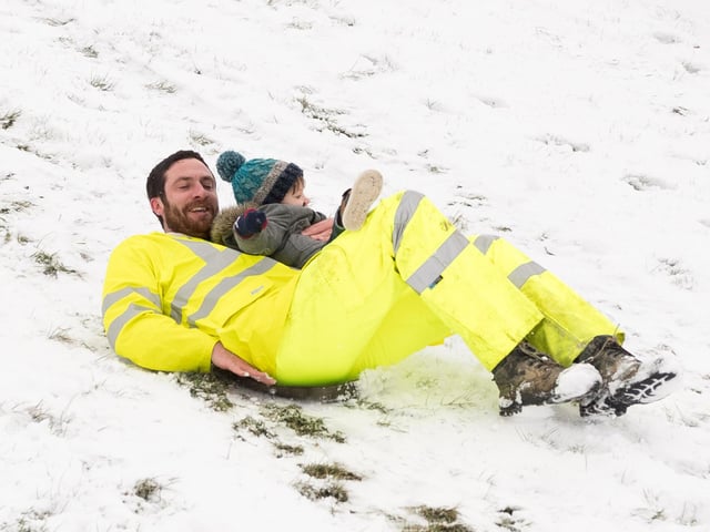 Jake and Maverick Gofton enjoy the snow in Southsea in March 2018. Picture: Keith Woodland