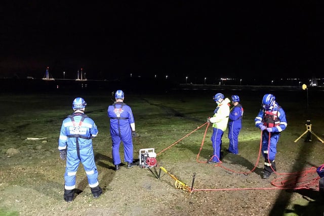 A crew from the Hill Head Coastguard helping to rescue two women stuck in the mud in Hilsea