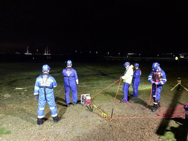 A crew from the Hill Head Coastguard helping to rescue two women stuck in the mud in Hilsea
