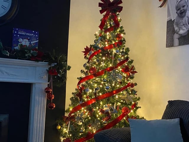 Shannon Clarke shared her tree that has a lovely red ribbon.