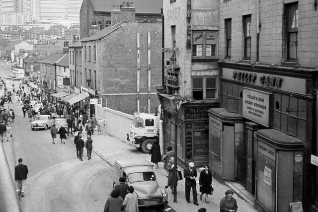 An old view of Dixon Lane showing Philip Cann's music shop on the right.  The shop later moved to Chapel Walk.