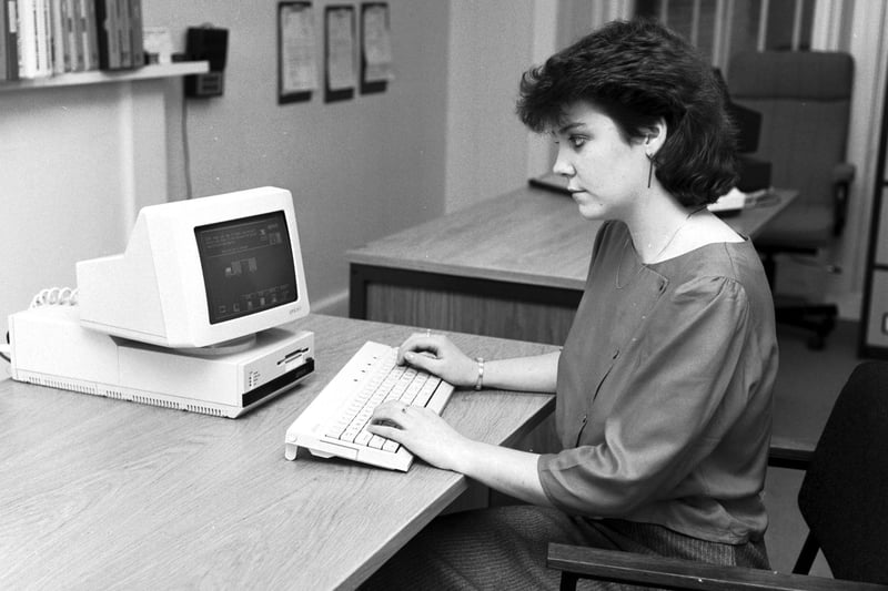 A woman demonstrates the new Apricot F1 computer at Microworld Computers in Edinburgh, October 1984.