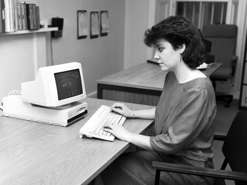 A woman demonstrates the new Apricot F1 computer at Microworld Computers in Edinburgh, October 1984.