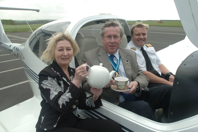 Pictured at Sheffield City Airport, where the High Sheriff John Biggin is seen being served tea by Janette Cotterill from Pollards to promote the Bluebell Wood Hospice Tea at 3 event. He planned to have tea at 3,000 feet in the plane with pilot Steve Ramsden of the City Airport flying school.