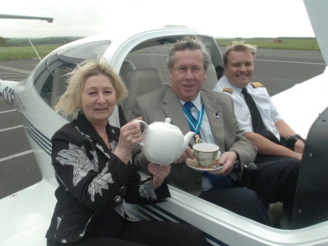 Pictured at Sheffield City Airport, where the High Sheriff John Biggin is seen being served tea by Janette Cotterill from Pollards to promote the Bluebell Wood Hospice Tea at 3 event. He planned to have tea at 3,000 feet in the plane with pilot Steve Ramsden of the City Airport flying school.