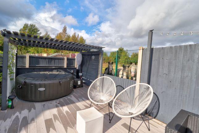 This hot tub is the landscaped garden of a three-bedroom bungalow which also has two ensuites. Guide price: £250,000