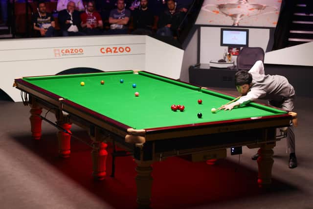 China's Si Jiahui in action at Sheffield's Crucible Theatre during the World Snooker Championship 2023. World Snooker Tour president Barry Hearn has revealed Qatar has expressed an interest in hosting the sport's premier tournament (Photo by George Wood/Getty Images)