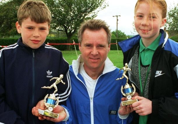 On Sunday, May 12, 1997 there was a fun run at Barnburgh Primary. Photographed are the two winners Richard Lindsay and Miriam Evans with marathon runner Tony-Barron Amith.