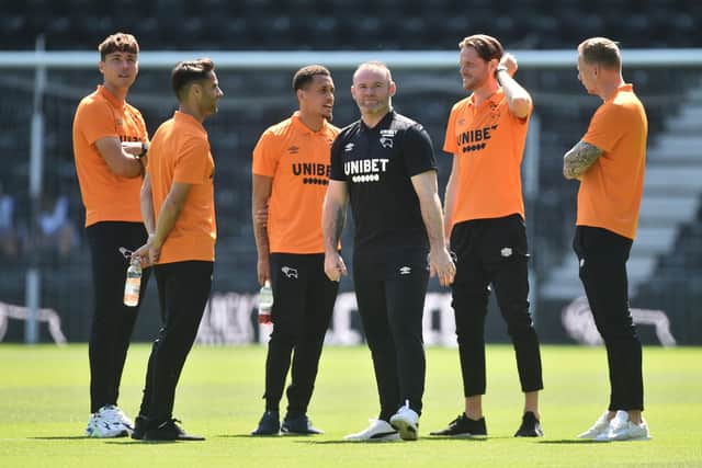 Wayne Rooney manager of Derby County and players look on before the pre-season friendly match between Derby County and Manchester United at Pride Park. (Photo by Nathan Stirk/Getty Images)