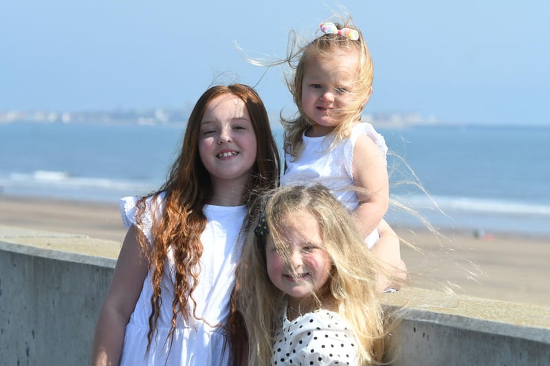 Lilly (11) and Poppy (2) Phillips and Marie Dixon (6) at Seaton Carew on Bank Holiday Monday
