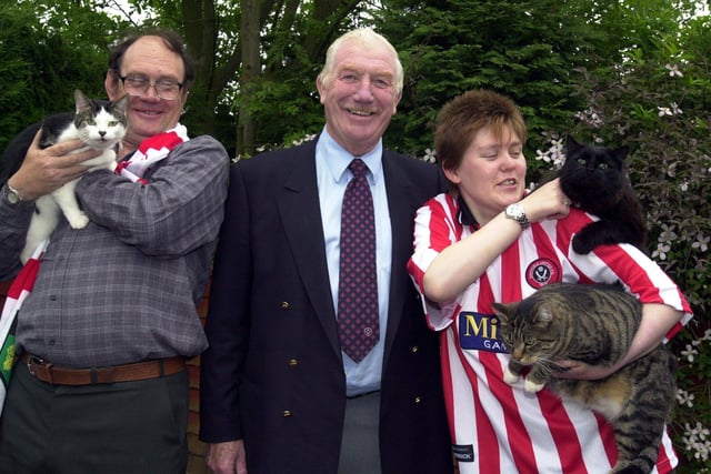 Derek Dooley with fans Reg and Susie Pantling with their cats named after Blades players, Tommy, Bobby and Bladey