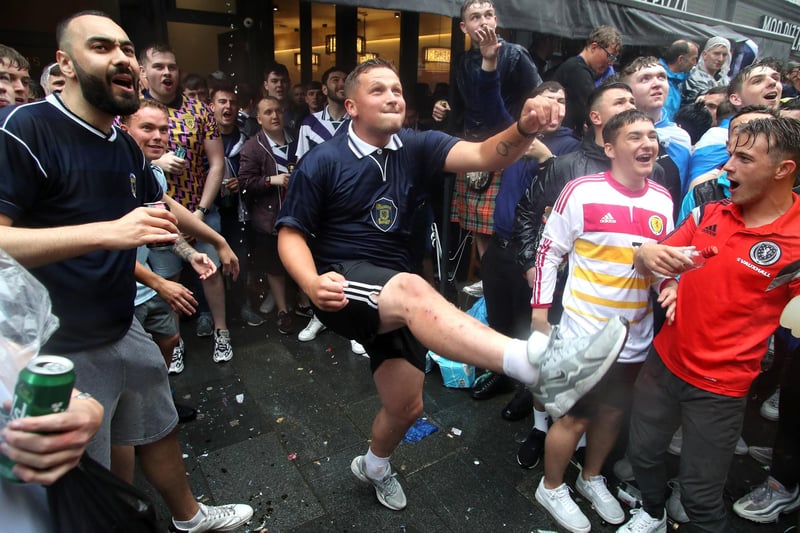 A fan in motion after kicking a football into the crowds (Photo: Kieran Cleeves/PA Wire).