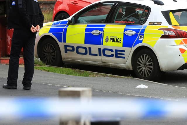 Sheffield Crown Court has heard how three robbers have been caged after a taxi-driver had his cab taken at knifepoint. Featured is a stock police crime image.