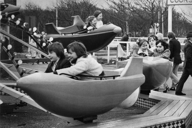 South Shields Amusement Park in 1974 and these people are having fun on the Lunar Jet ride.