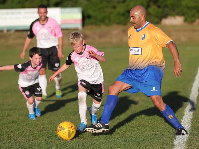 Evie's nine-year-old brother Billy Wilson tackles Mark Clifford.
Billy went on to score in the match.
