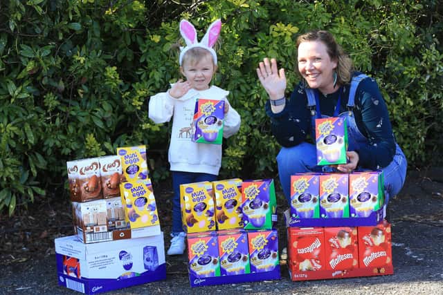 Alice Cleverley is almost 3yrs old and was worried that some boys and girls wouldn't get Easter eggs. So with the help of her mum Lauren Swann she had made bracelets and sold them to raise money for Baby Basics Sheffield. Alice is pictured with Cat Ross CEO of Baby Basics. Picture: Chris Etchells