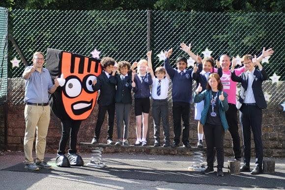 Cllr Ben Curran (left) and Cllr Tom Hunt (right) join pupils and staff from St Mary’s CE Academy and Living Streets’ mascot, Strider; (and) pupils with Living Streets’ mascot, Strider.